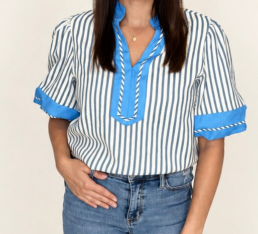 Close-up of The Hadley Stripe Top, blue and white stripes with bright blue V-neck trim