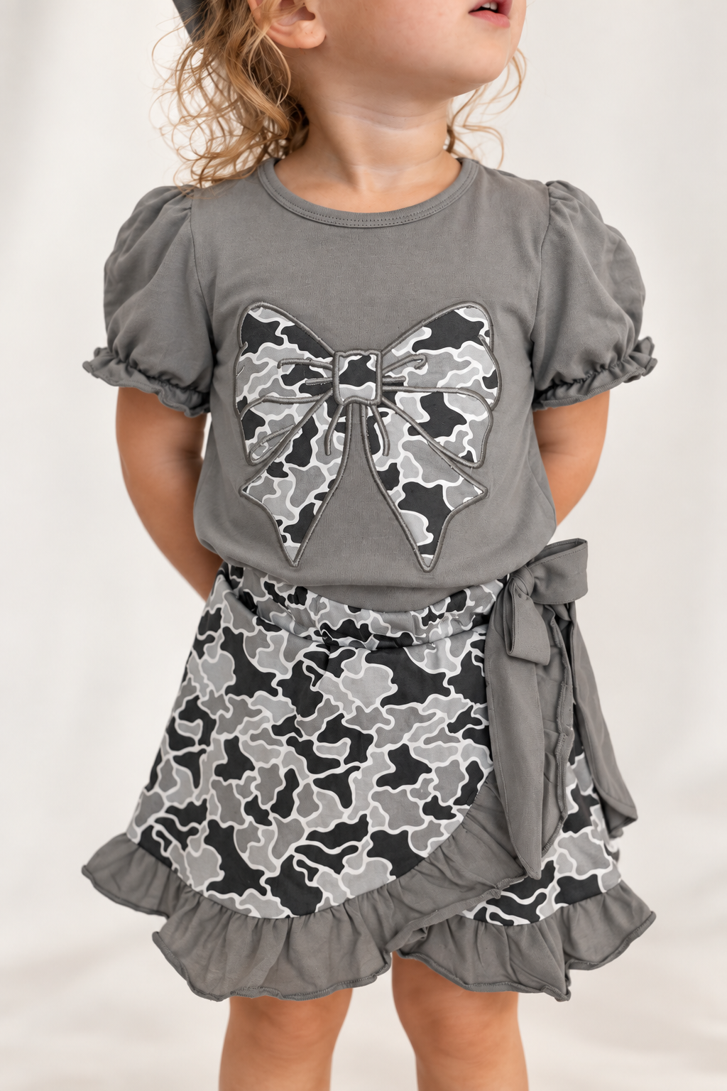 Close-up of The Collins Camo Bow Skort Set with side tie