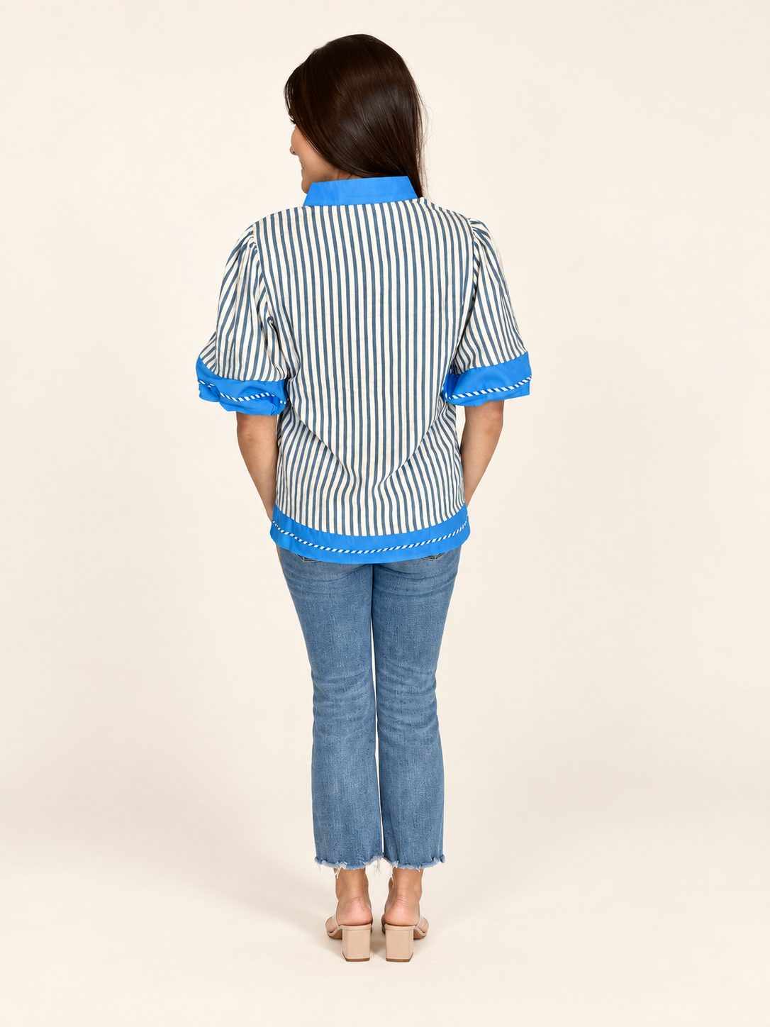 Back view of The Hadley Stripe Top showing blue hem trim