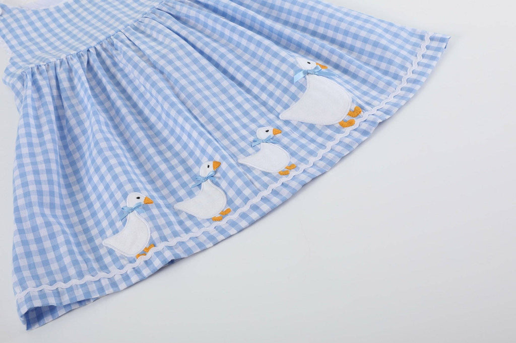 Close-up of the goose appliques on The Little Goose Dress hem