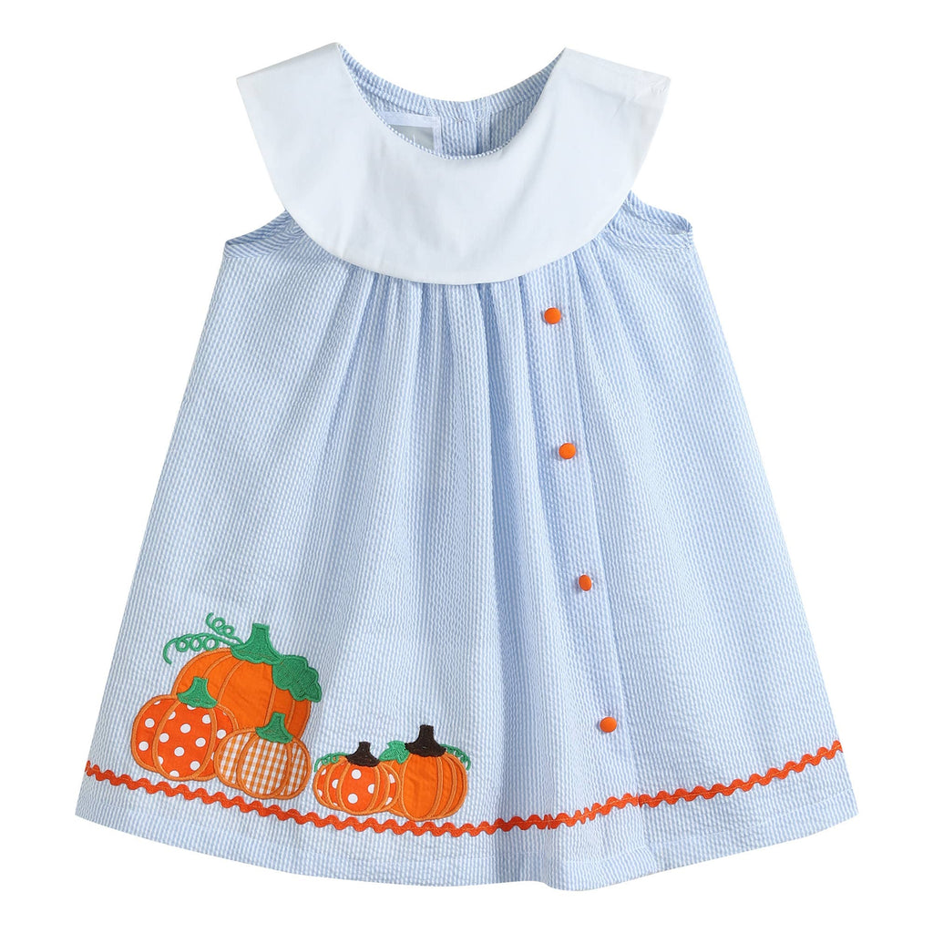 The Pumpkin Patch Dress flat front view with orange buttons and ric-rac trim