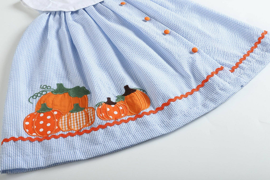 Close-up of the pumpkin applique on The Pumpkin Patch Dress hem