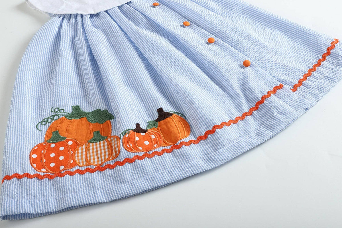 Close-up of the pumpkin applique on The Pumpkin Patch Dress hem
