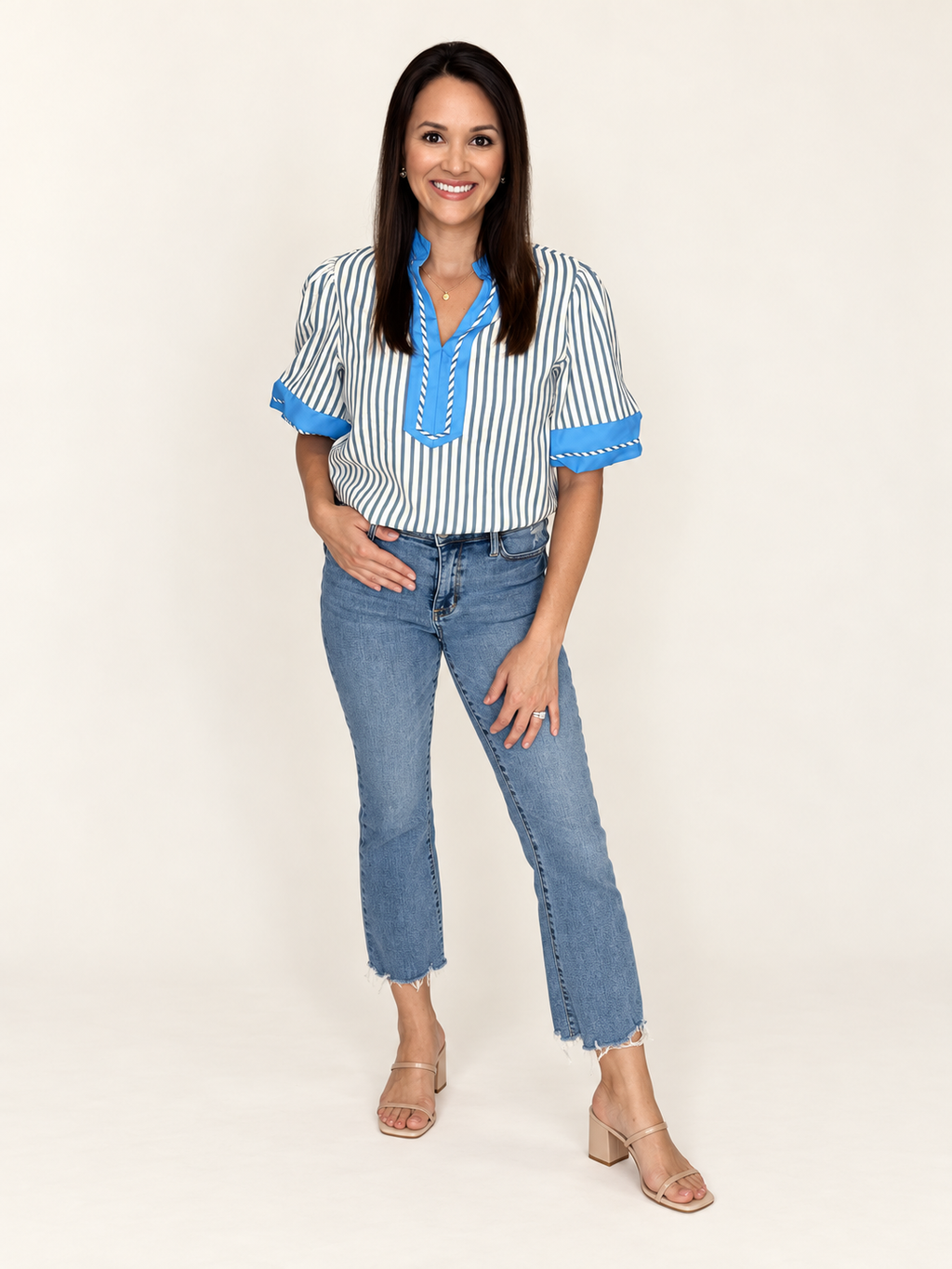 Woman wearing The Hadley Stripe Top with cropped jeans, front view